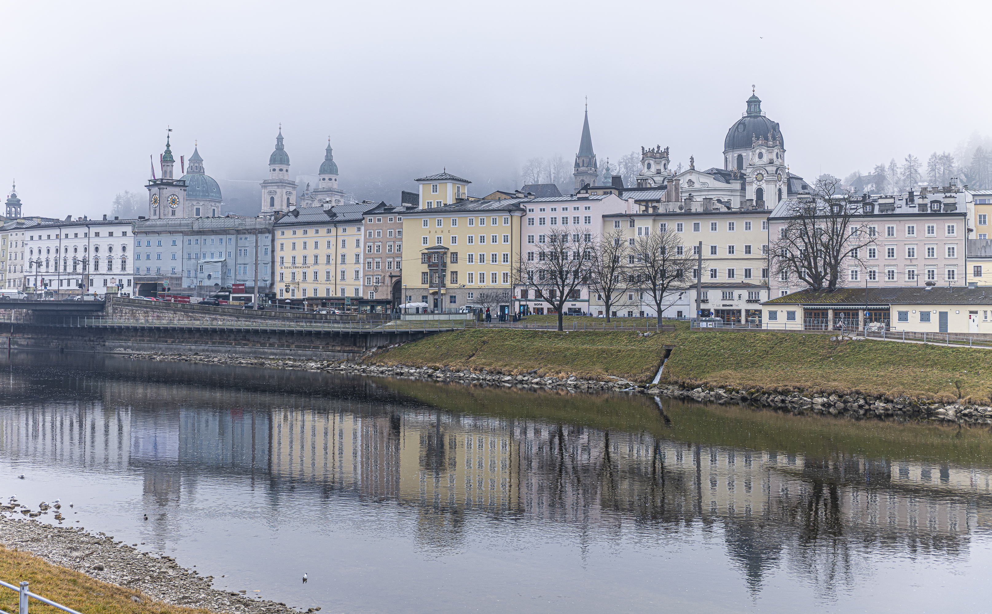 City reflected in the Salzach river