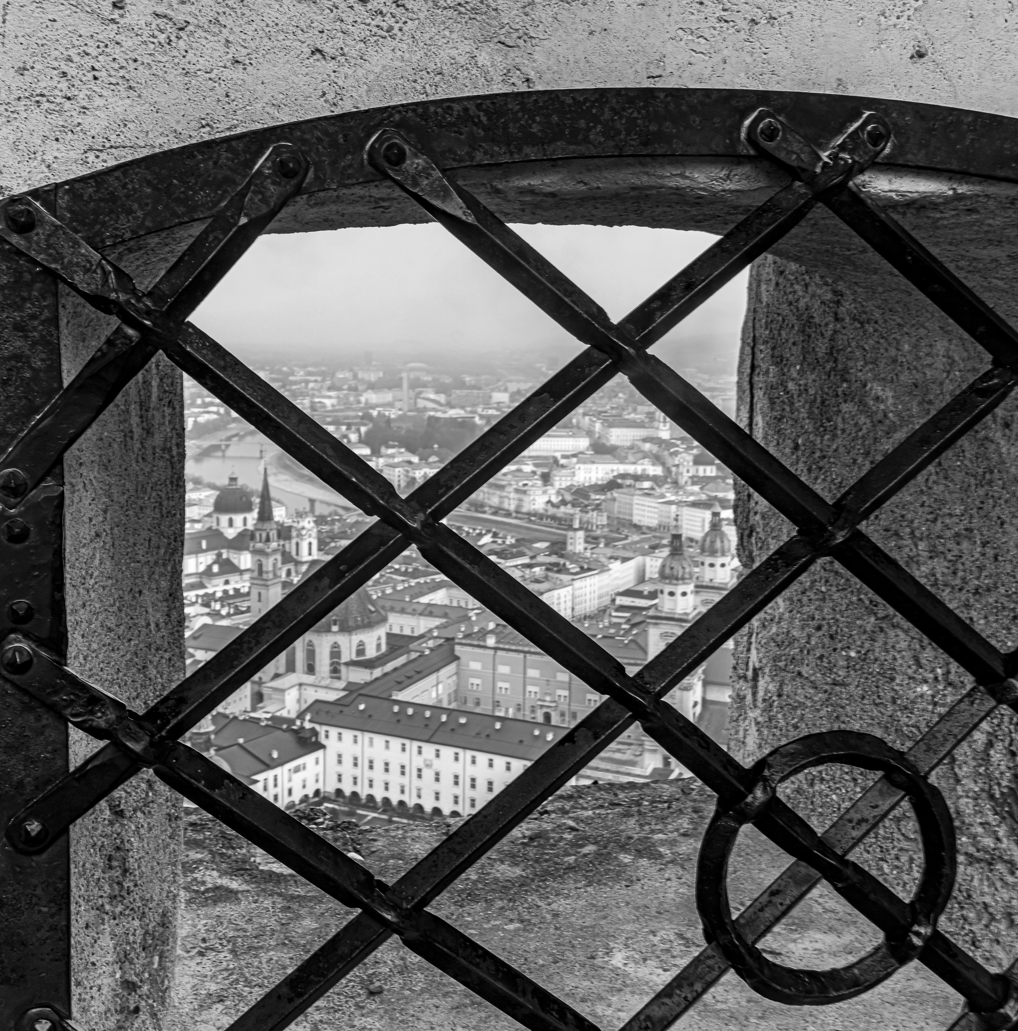 View of the city through the iron grating