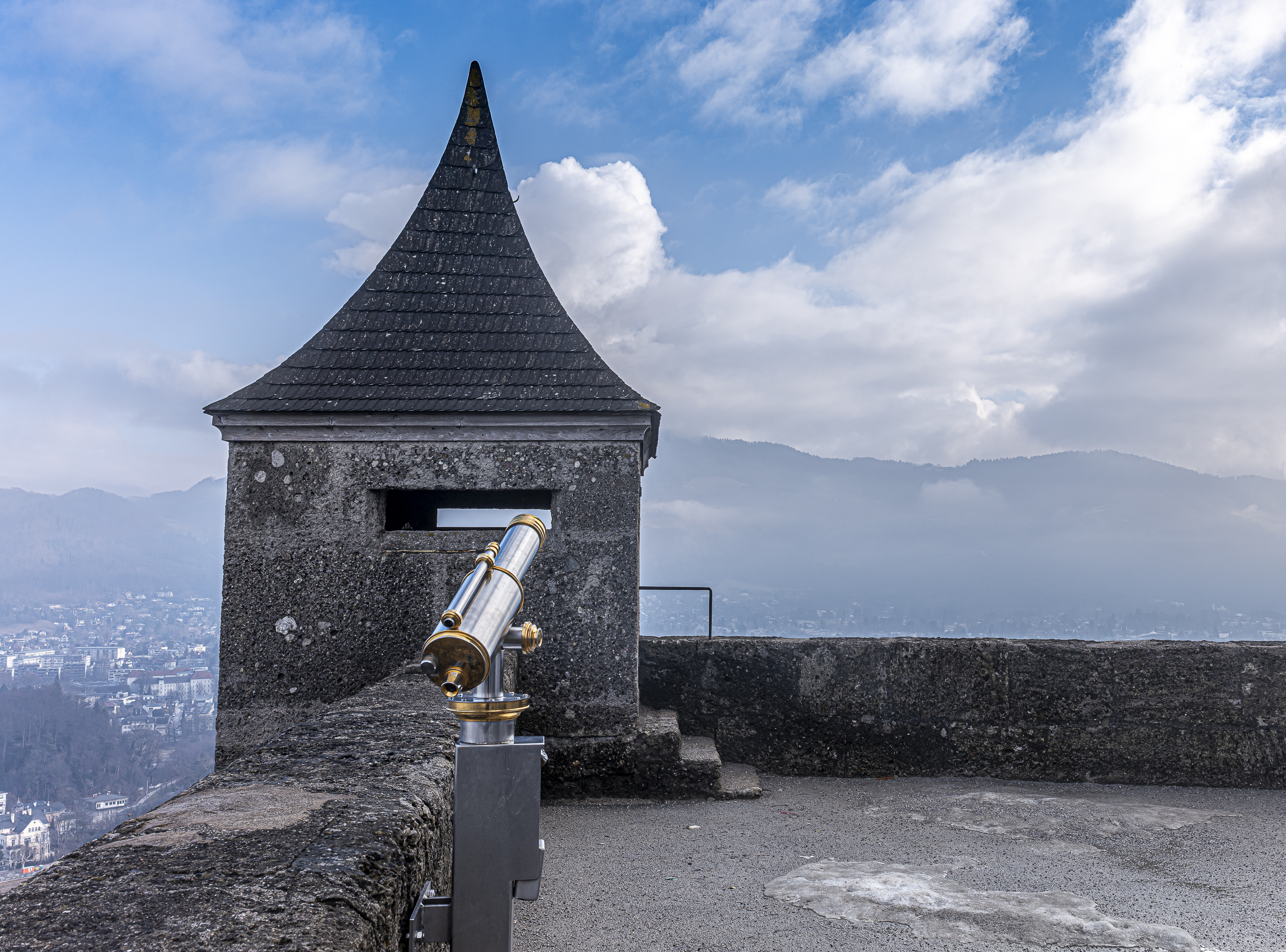 Telescope on the battlements with views of the Alps