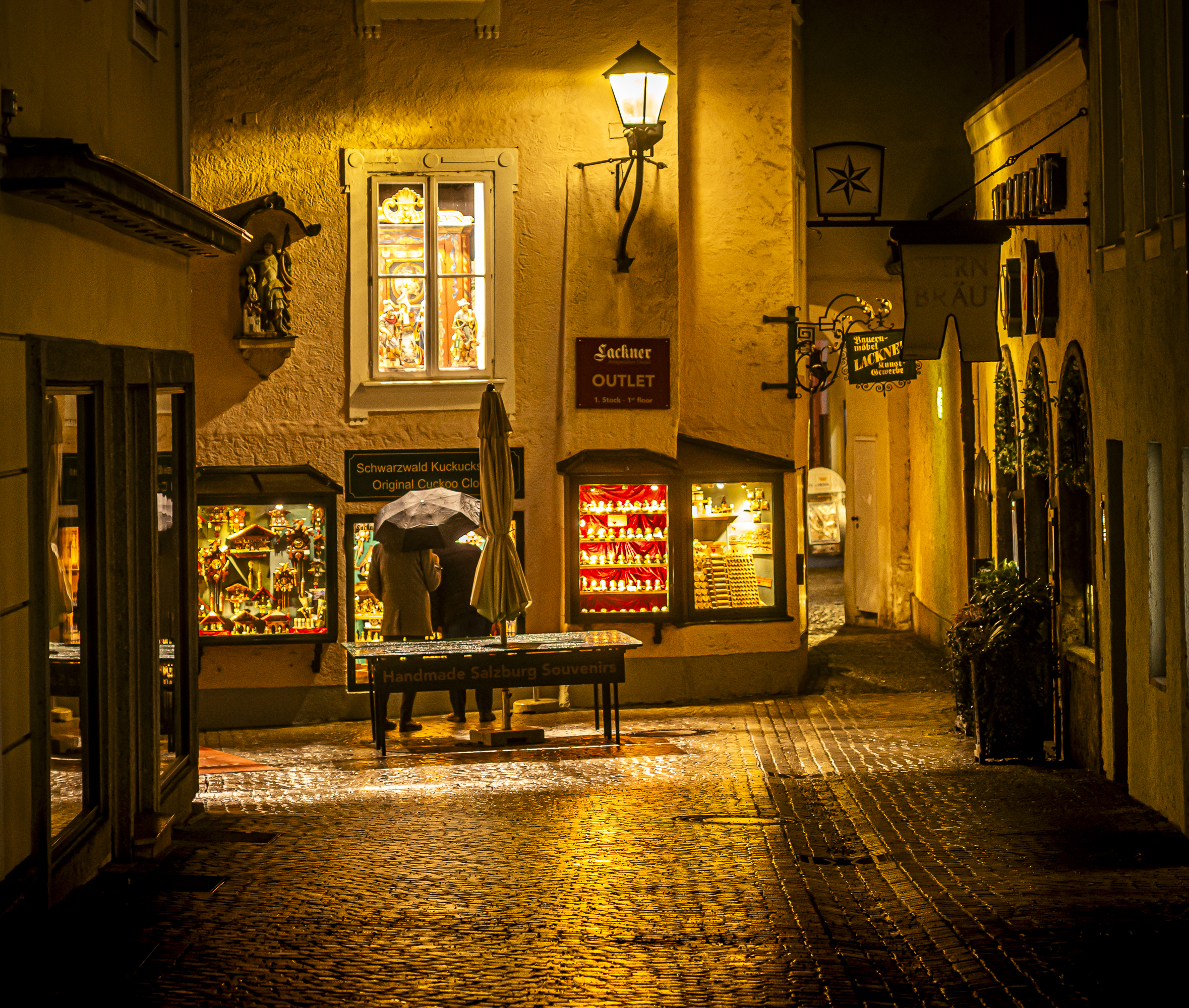 Nocturnal alley with umbrella